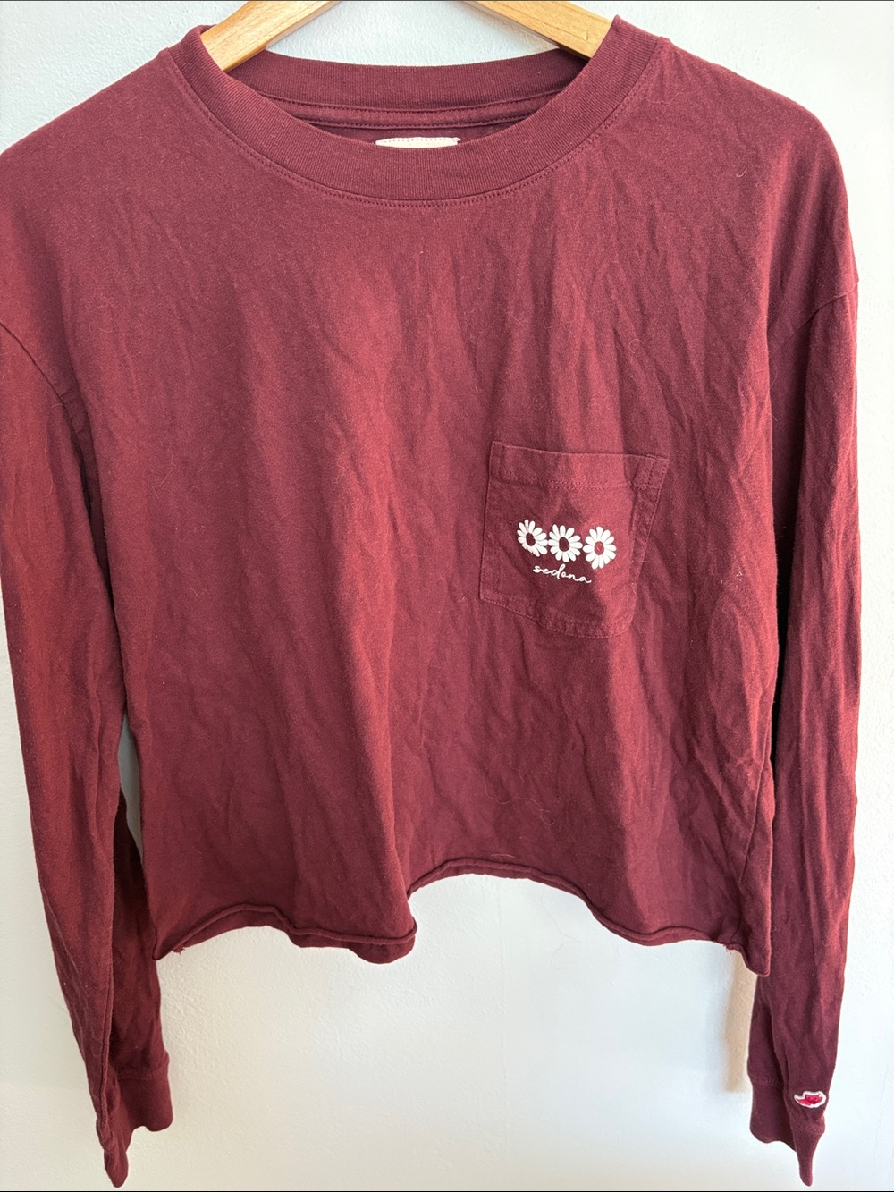 League Burgundy Long-Sleeve Pocket Tee with White Daisy Graphic